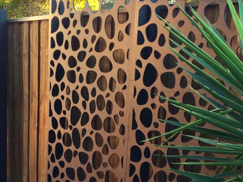 Laser cut metal decorative screen for enhanced look of existing fence