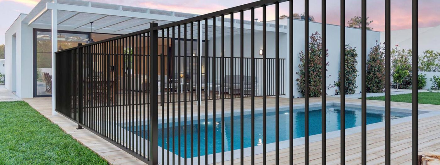Metal fencing around a swimming pool at a residential home